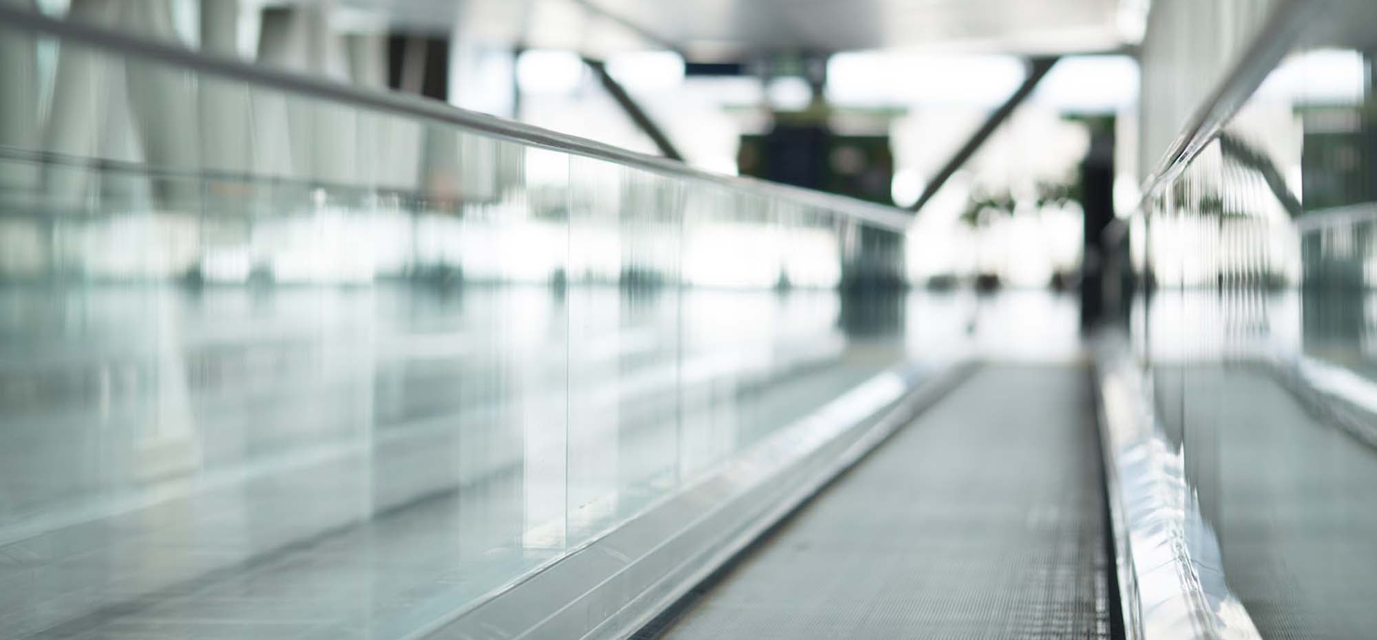 A photo of the moving baggage platforms inside the airport