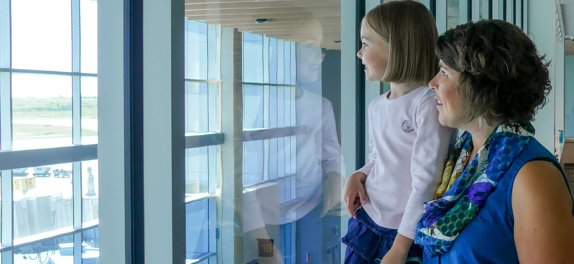 Woman and child looking out from the observation deck